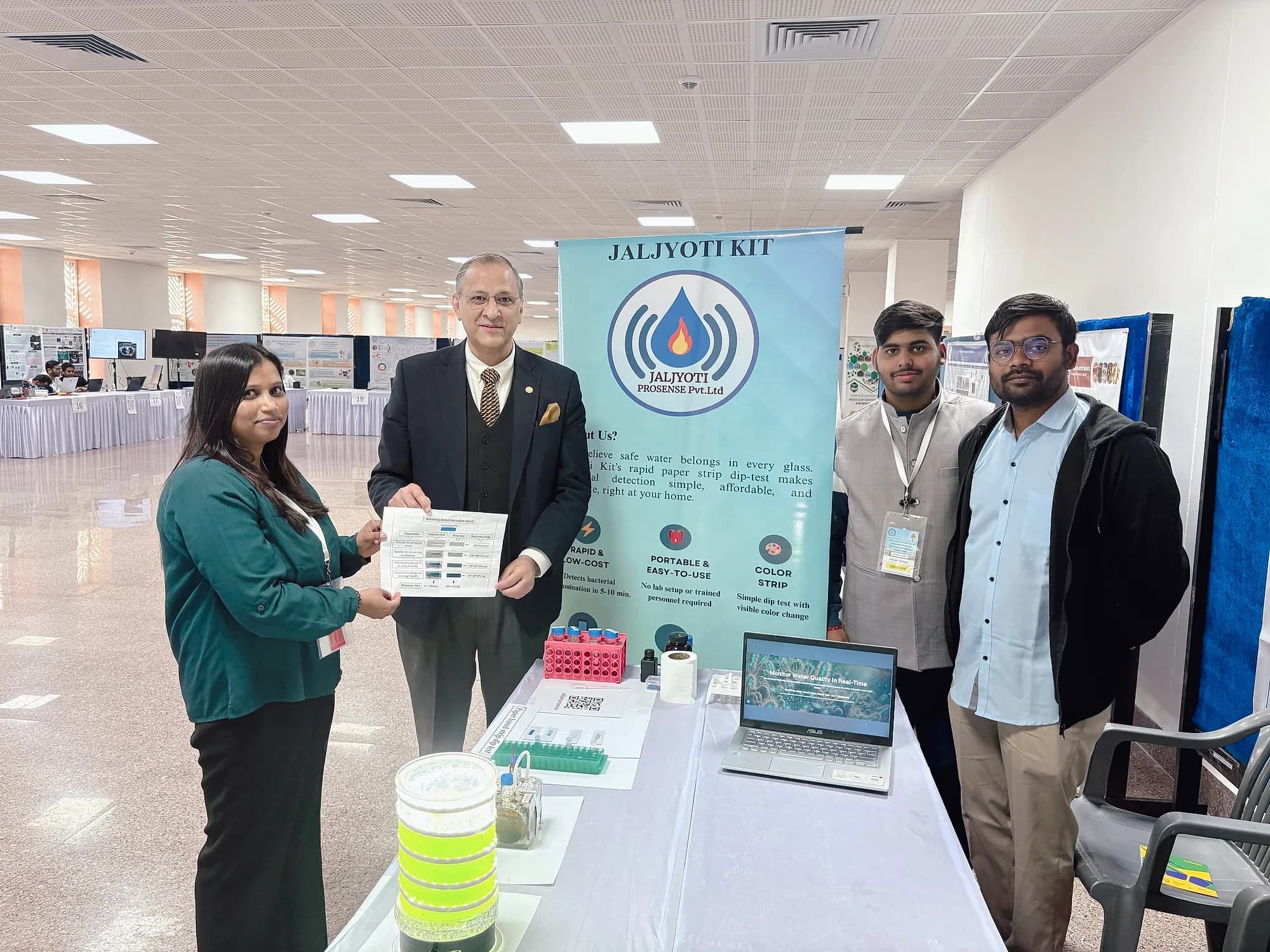 The team at their exhibition stand with the kit on display.
