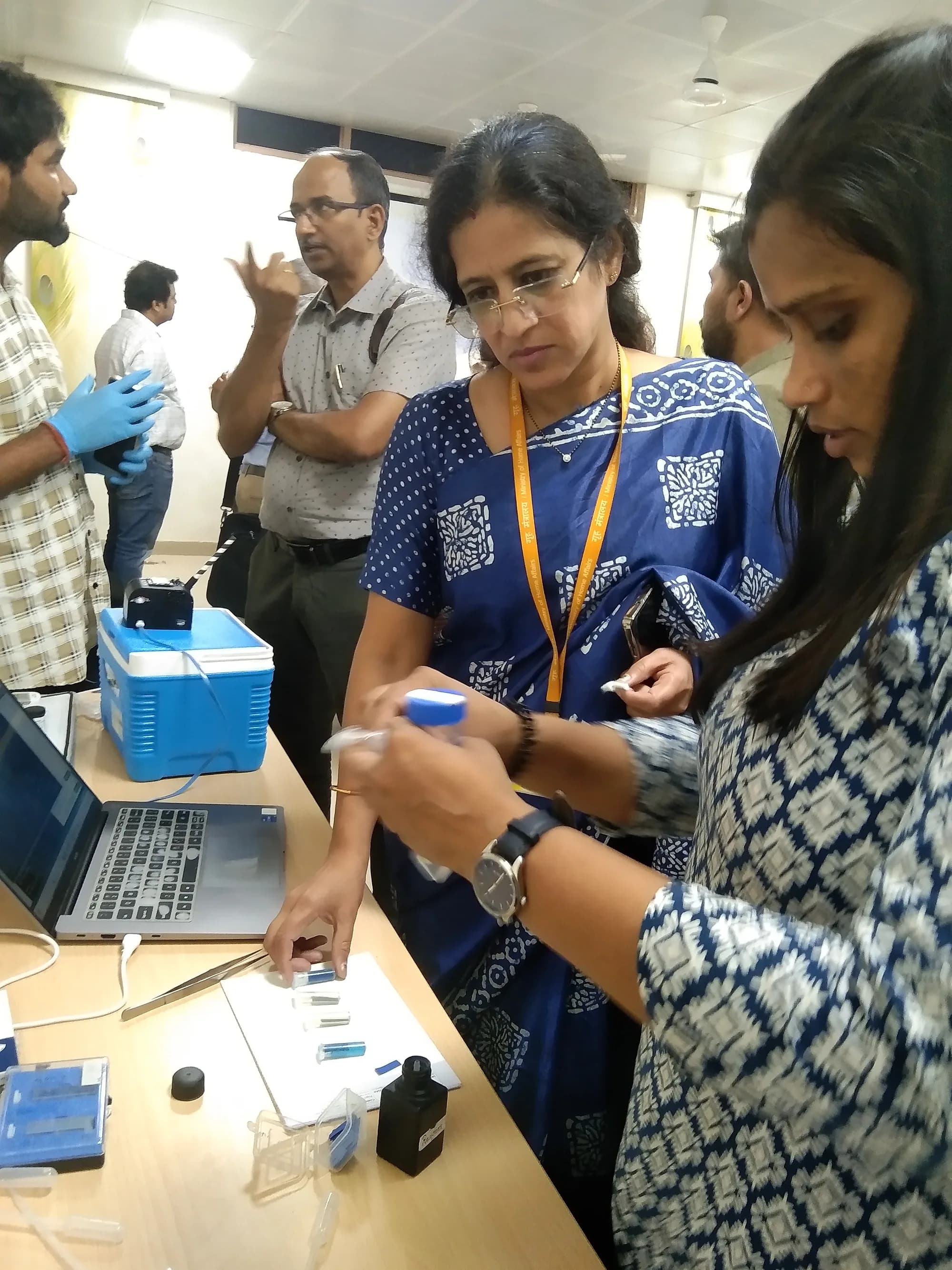 Walking visitors through the test at a demonstration table.