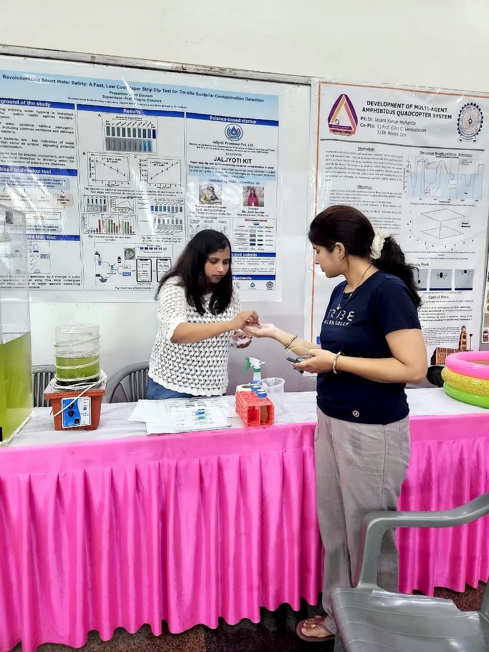 Walking visitors through a live test at the exhibition stall.
