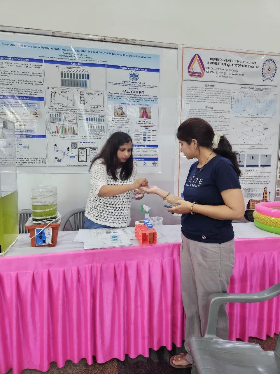 Walking visitors through a live test at the exhibition stall.