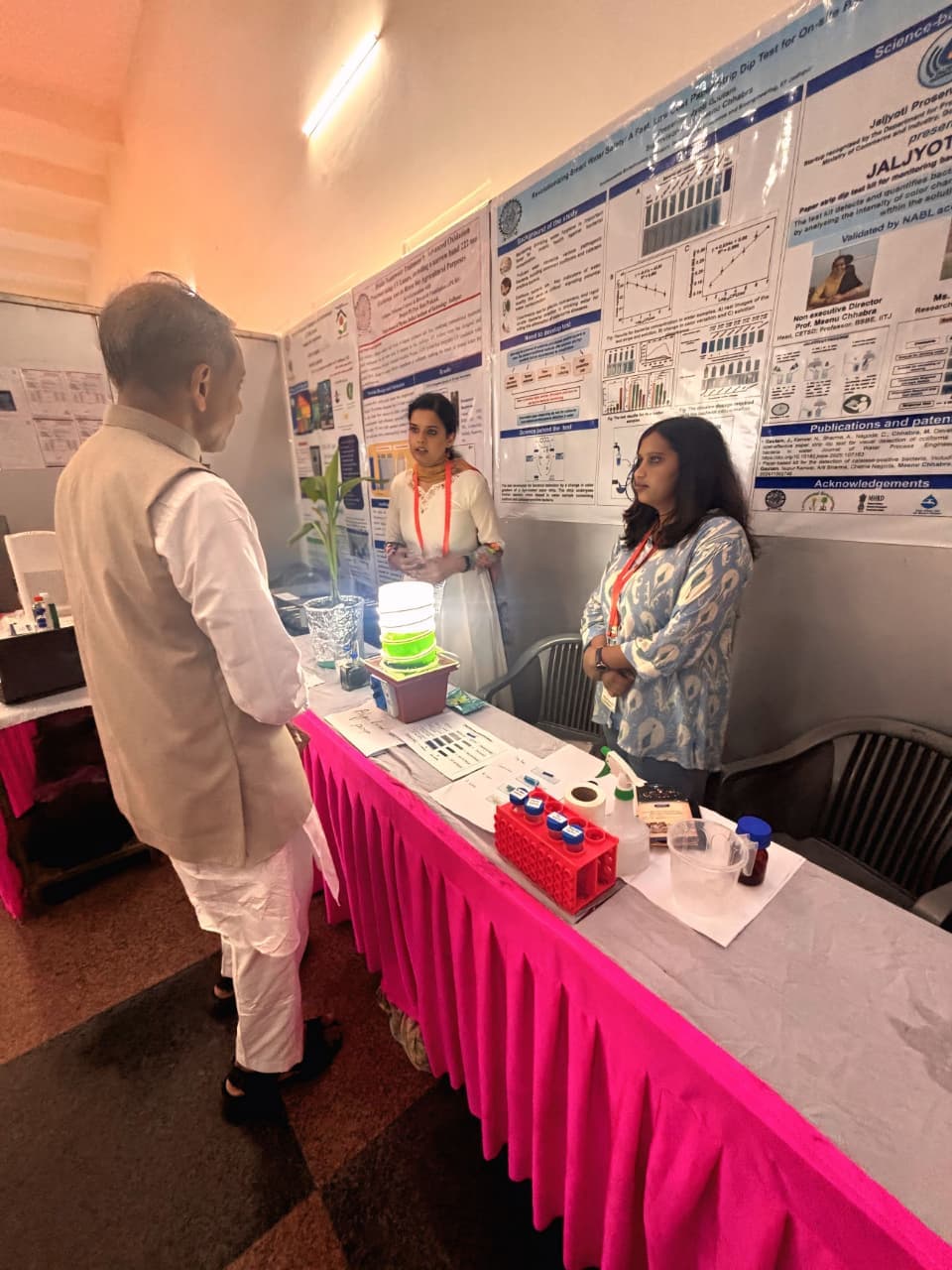 The Jaljyoti team demonstrating the paper-strip test at a research exhibition
