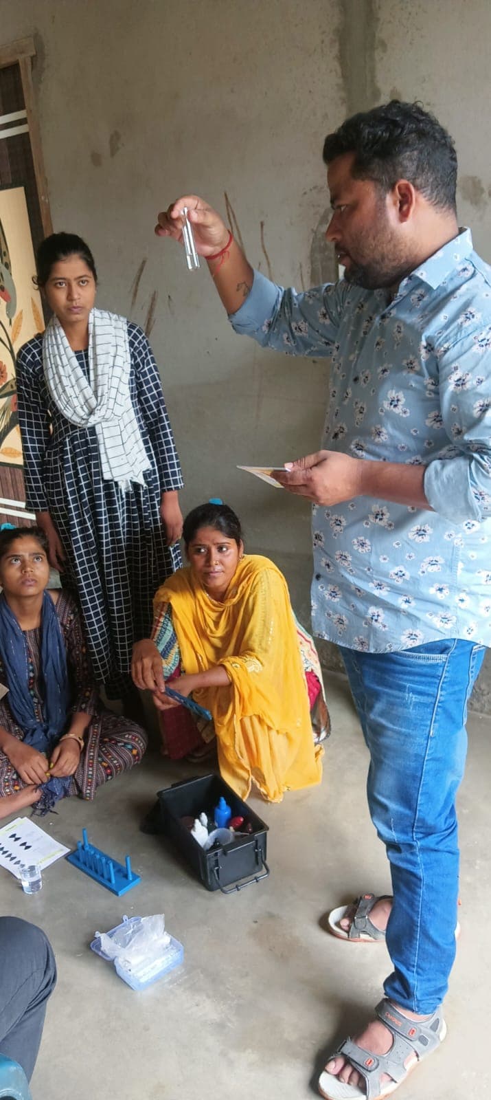 Presenting the kit to residents in a rural area, where lab access is hardest.